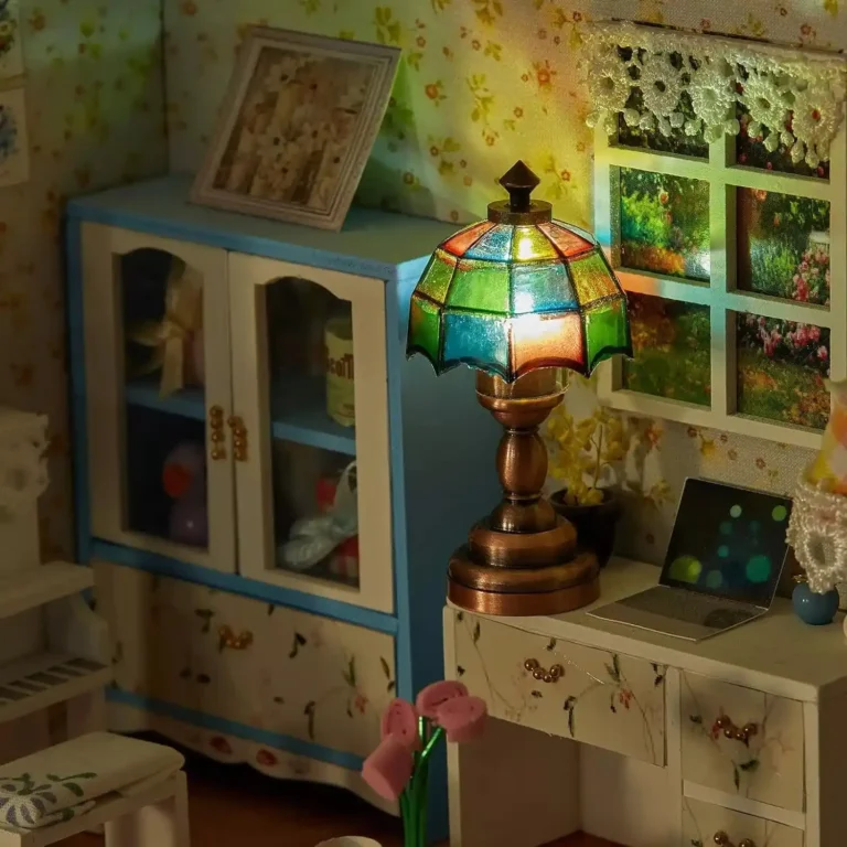 mini-table-lamp-on-the-desk A glowing Tiffany-style dollhouse lamp sits on the table