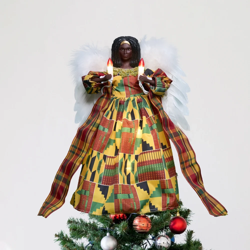 A 12-inch gold animated kente black angel tree topper stands on the tree