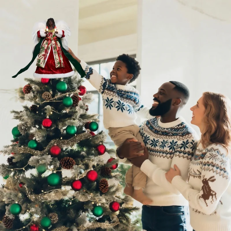 Heartwarming Christmas moment: father helps boy put a red black angel tree topper while mother looks on smiling