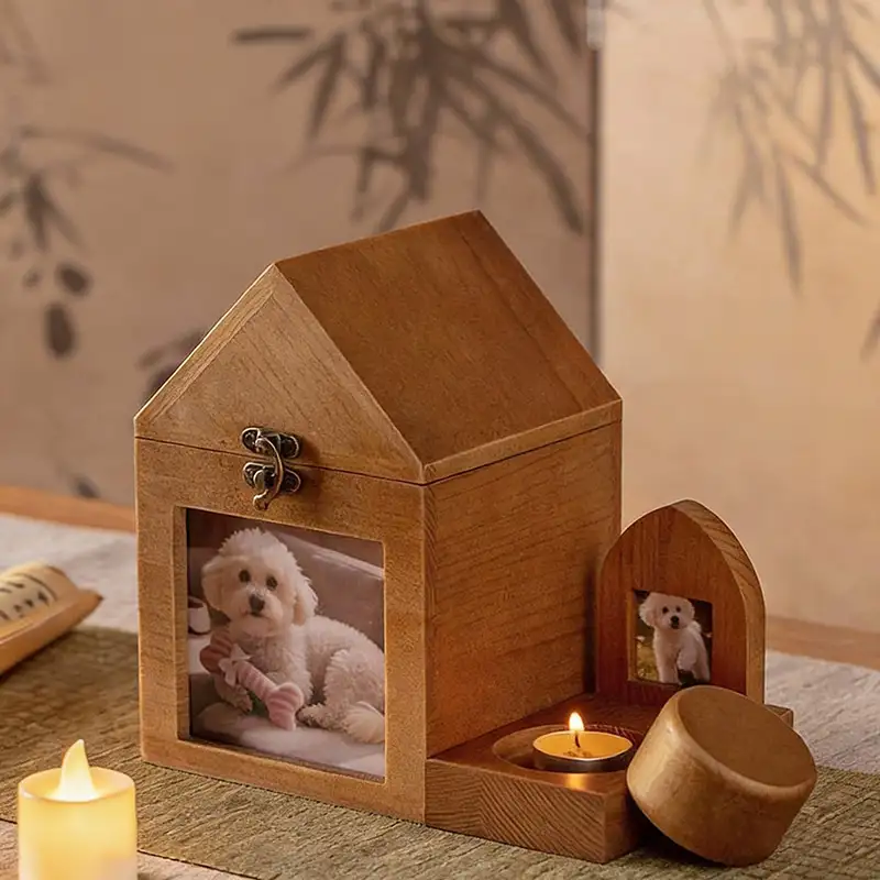 house-shape-wooden-pet-ashes-keepsake-box-with-photo-frame (5) There is a pet ashes keepsake box with a candle holder