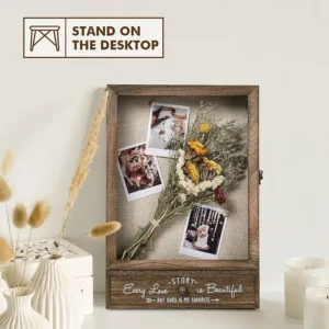 large-wedding-keepsake-shadow-box-with-removable-shelves-and-drawers (5) A weding shadow box is on the table