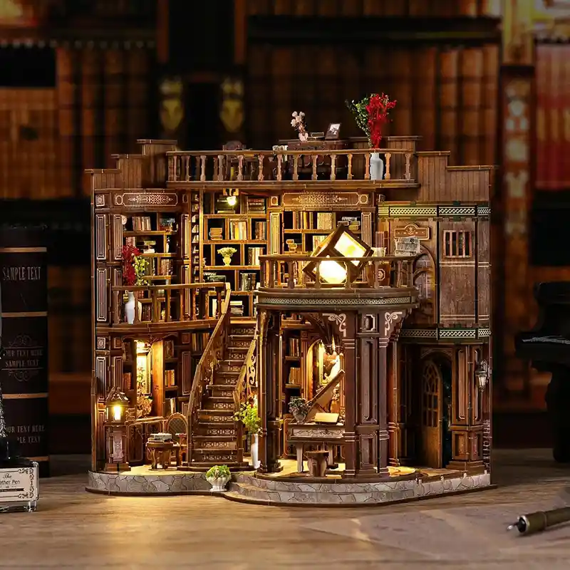 A book hall miniature house is on the desk
