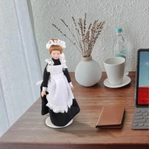 a-porcelain-maid-is-on-the-desk A porcelain maid is on the desk