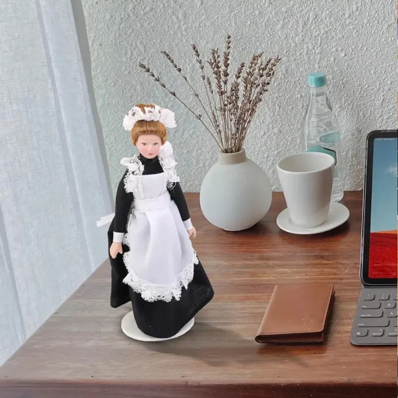 a-porcelain-maid-is-on-the-desk A porcelain maid is on the desk